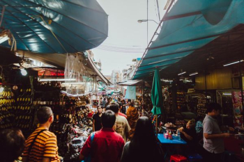 people walking inside food market people walking inside food market