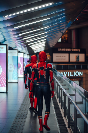 People Wearing Spider-man Adult Costume Walking on Train Station People Wearing Spider-man Adult Costume Walking on Train Station