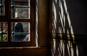 person behind window frame person behind window frame