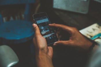 person browsing on his/her phone person browsing on his/her phone