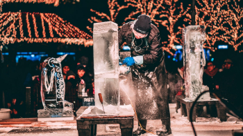 Person Carving Ice Sculptures Person Carving Ice Sculptures