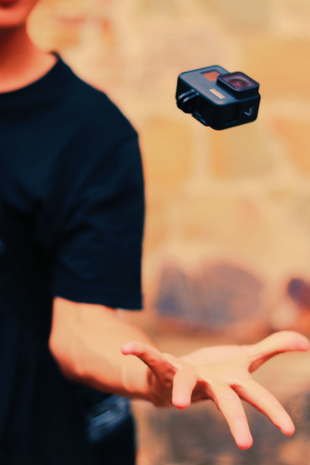 Person Catching Black Action Camera Person Catching Black Action Camera