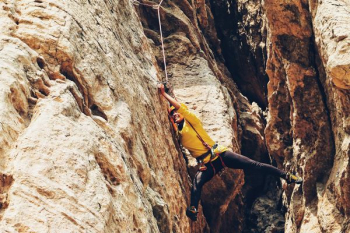 person climbing on the rock person climbing on the rock