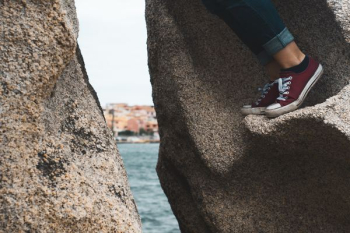 person climbing rocks person climbing rocks