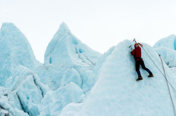 person climbing snowy mountain person climbing snowy mountain