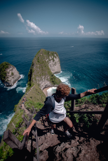 Person Climbing Up Rock Stairs Person Climbing Up Rock Stairs