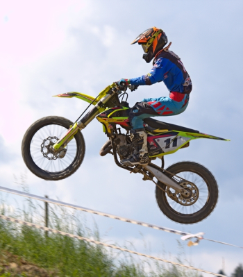 Person Doing Stunt in Motocross Dirt Bike Person Doing Stunt in Motocross Dirt Bike