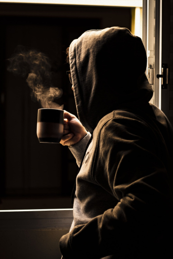 Person Drinking Coffee Next to Window Person Drinking Coffee Next to Window
