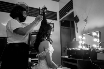 Person Fixing Woman&#39;s Hair