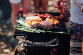 person grilling meat person grilling meat