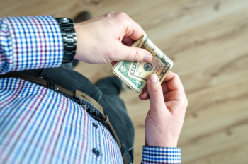 Person Holding 100 Us Dollar Banknote Person Holding 100 Us Dollar Banknote