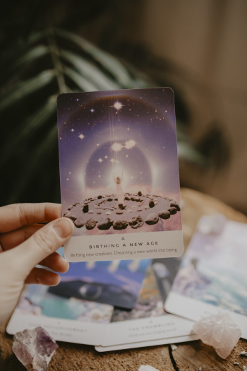 Person Holding a Tarot Card Person Holding a Tarot Card