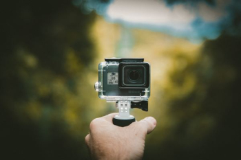 person holding action camera person holding action camera