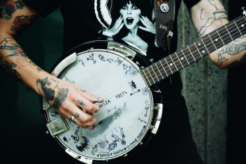 Person Holding Banjo Person Holding Banjo