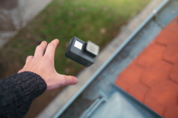 Person Holding Black Action Camera Person Holding Black Action Camera