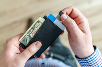 Person Holding Black Card Holder Person Holding Black Card Holder