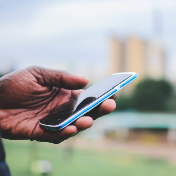 Person Holding Blue Smartphone