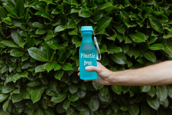 Person Holding Blue Water Bottle
