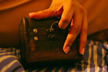 Person Holding Brown Wooden Chest Person Holding Brown Wooden Chest