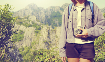 Person Holding Camera Standing Beside Tree Person Holding Camera Standing Beside Tree