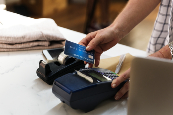 Person Holding Card and Terminal Person Holding Card and Terminal