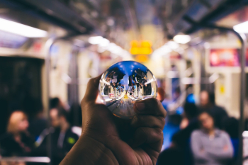 Person Holding Clear Glass Ball Person Holding Clear Glass Ball