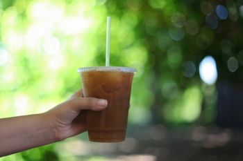 Person Holding Clear Plastic Cup