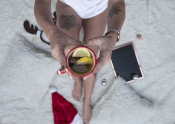 Person Holding Cup Filled With Brown Liquid Person Holding Cup Filled With Brown Liquid