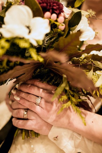 Person Holding Flower Bouquet