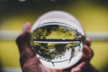 Person Holding Glass Ball Person Holding Glass Ball