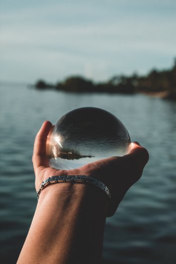 Person Holding Glass Ball Person Holding Glass Ball