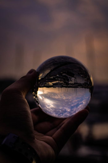 Person Holding Glass Ball Person Holding Glass Ball