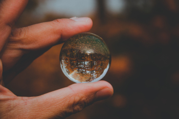 Person Holding Glass Ball Person Holding Glass Ball