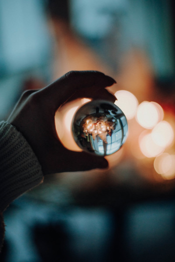 Person Holding Glass Ball Person Holding Glass Ball
