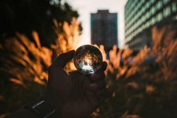person holding glass ball person holding glass ball