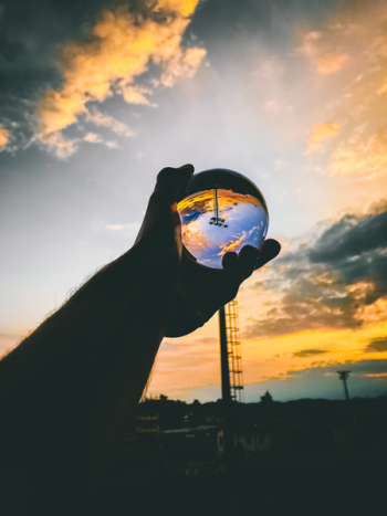 Person Holding Glass Ball Person Holding Glass Ball