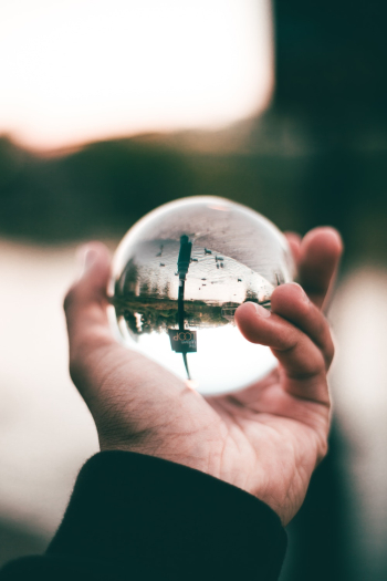Person Holding Glass Ball Person Holding Glass Ball