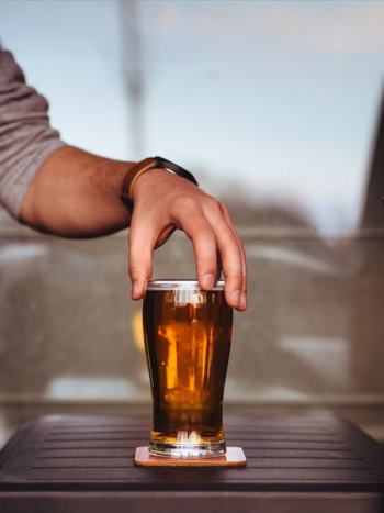 person holding glass cup person holding glass cup