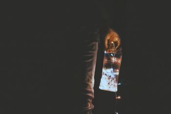 Person Holding Glass Jar Person Holding Glass Jar