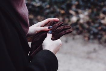 Person Holding Gloves Person Holding Gloves