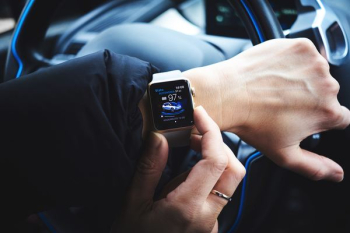 person holding gold aluminum Apple Watch person holding gold aluminum Apple Watch