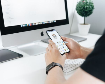 person holding iPhone X person holding iPhone X