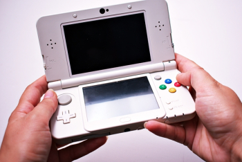 Person Holding Nintendo Ds Person Holding Nintendo Ds