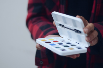 Person Holding Paints Person Holding Paints