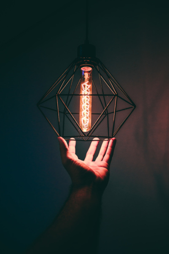 Person Holding Pendant Light Person Holding Pendant Light