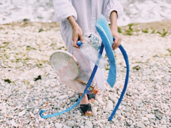Person Holding Plastic Bottle Person Holding Plastic Bottle