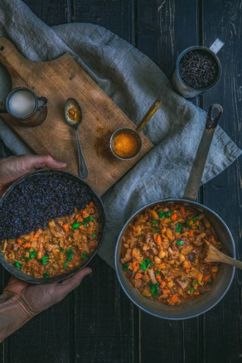 person holding pot with cook food person holding pot with cook food