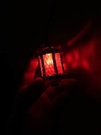 person holding red light