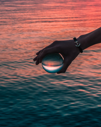 Person Holding Round Glass Ball Person Holding Round Glass Ball