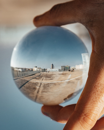 Person Holding Round Glass Ball Person Holding Round Glass Ball
